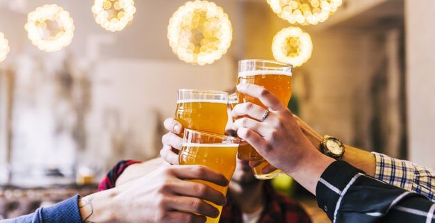 close-up-friends-hand-toasting-beer-glasses-party_23-2148153834-626x321